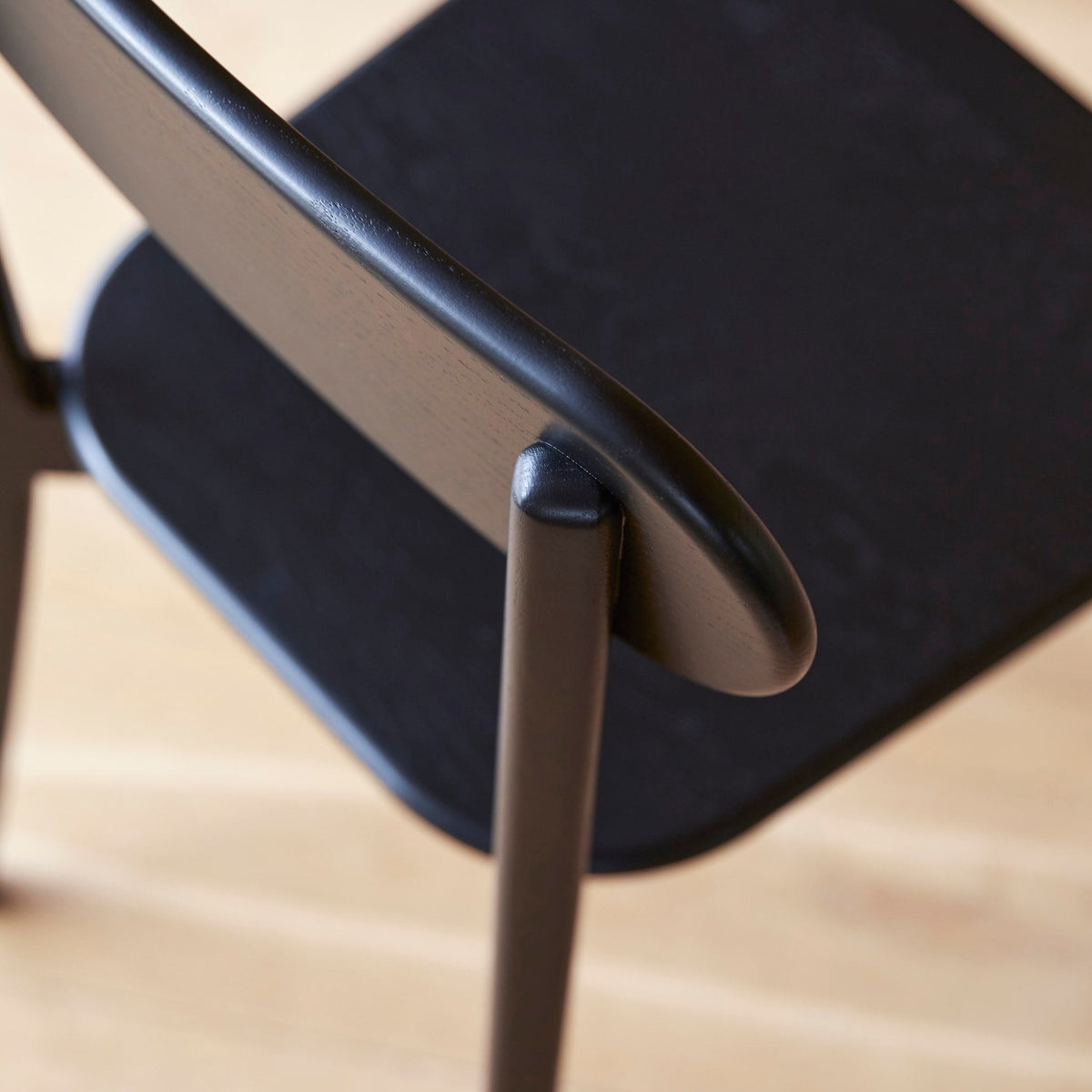 Tikamoon Abel black oak dining chair, side profile