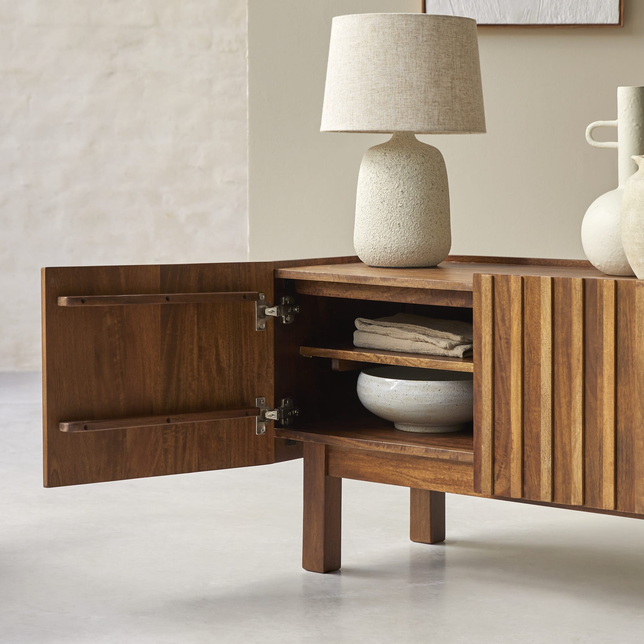 Tikamoon Milo TV stand in solid mango wood, angled view