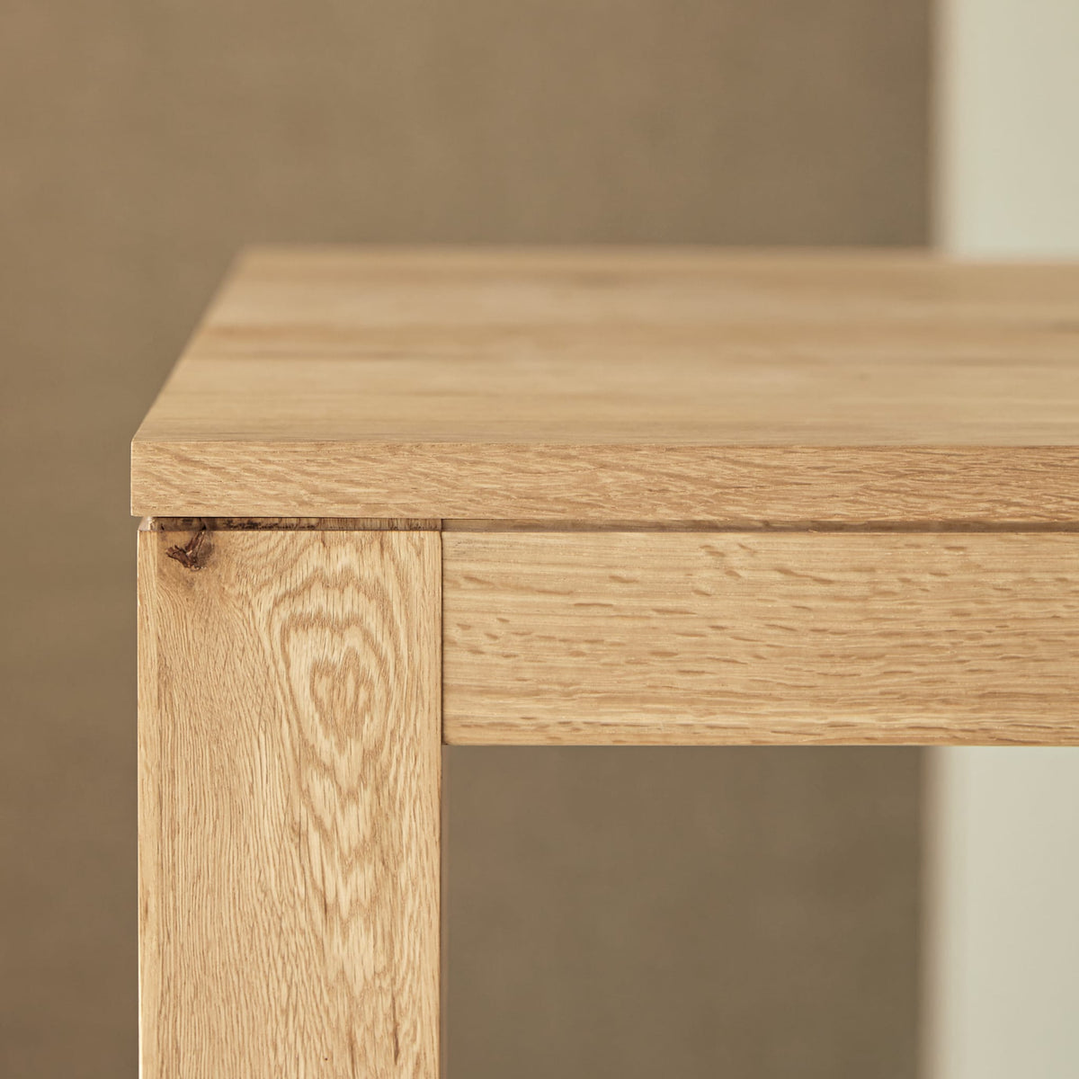 Tikamoon Eden extendable dining table in solid oak, corner view