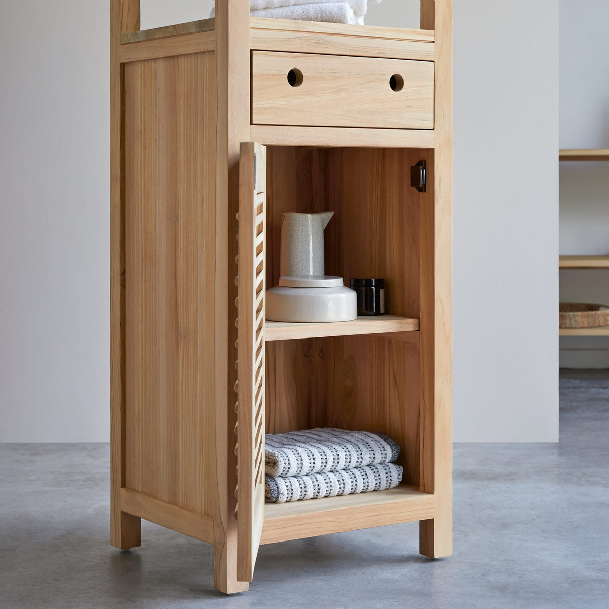 Coline teak bathroom cabinet, angled view