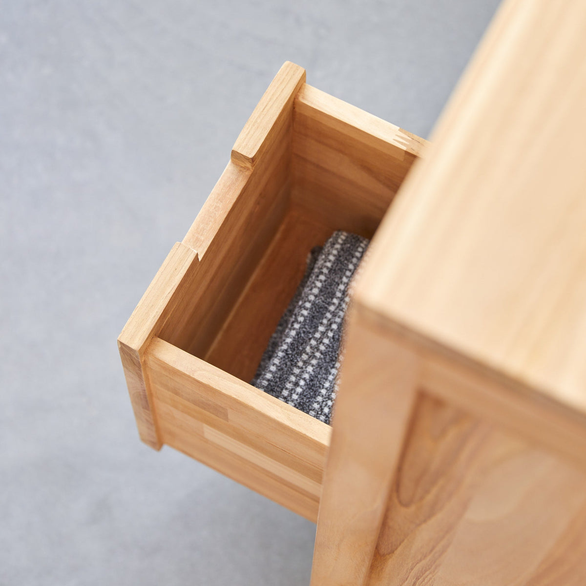 Tikamoon Serena solid teak vanity cabinet, top view of the counter and drain hole