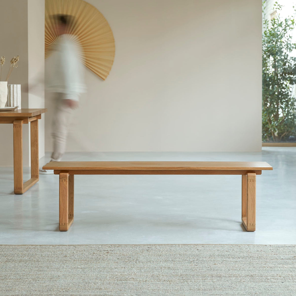 Tikamoon Sybille bench in solid oak, angled view
