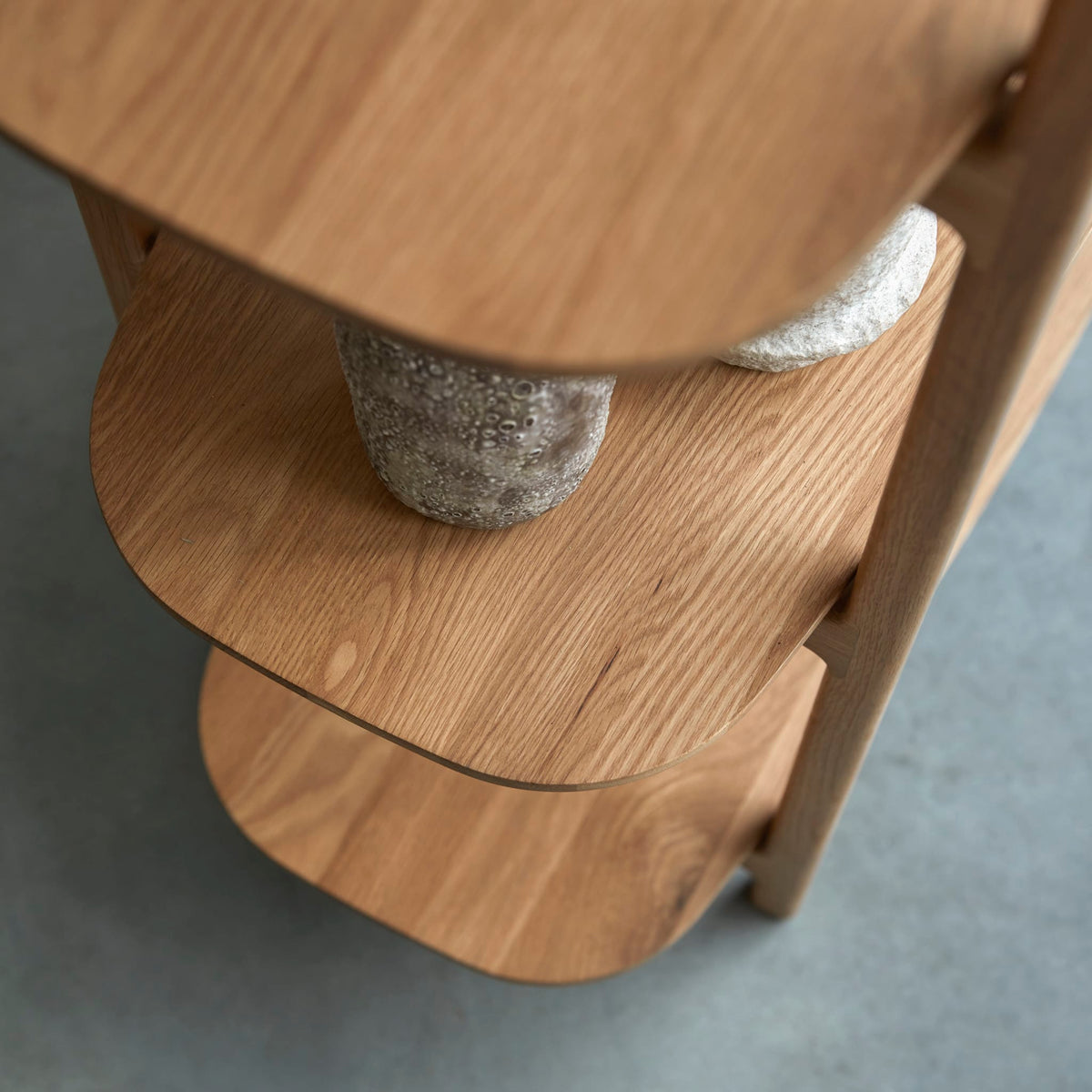 Tikamoon Rozenn oak bookcase, side view showing the rounded uprights