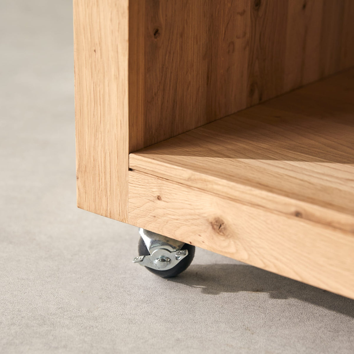 Tikamoon Anoa oak coffee table, detail of a castor beneath the leg