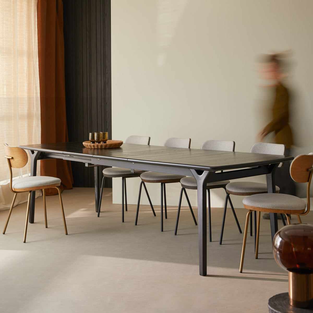 Tikamoon Clara black oak dining table extended in a dining room