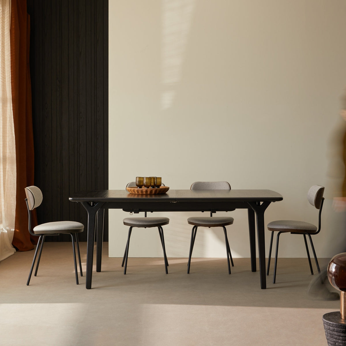 Tikamoon Clara black oak dining table closed with four chairs