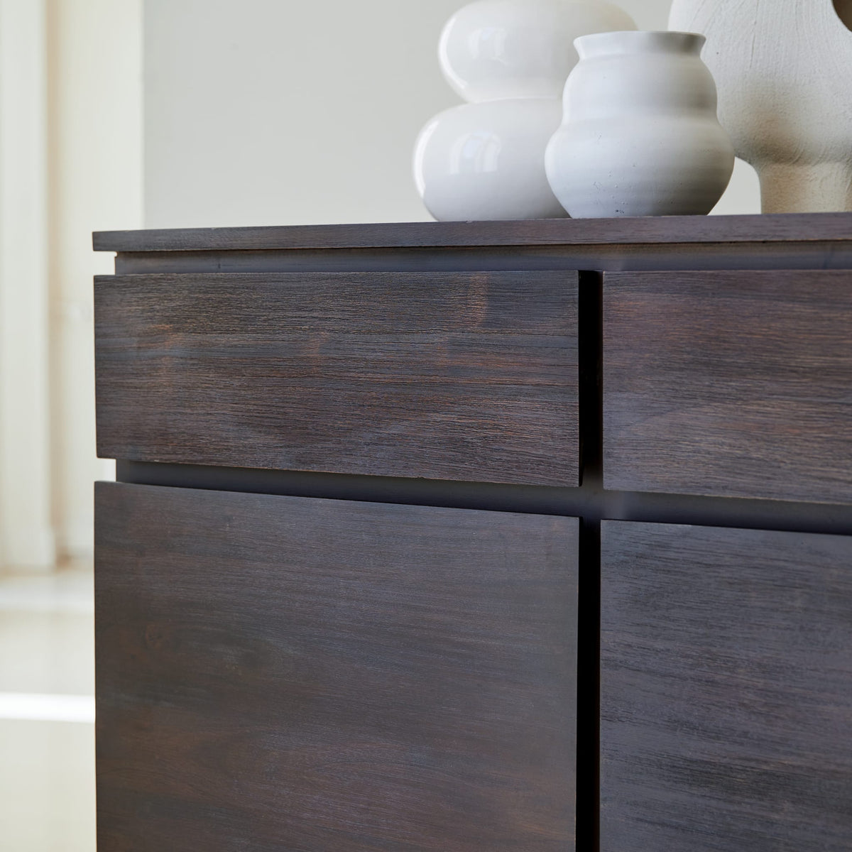 Tikamoon Eva sideboard in solid mahogany, detail of the tapered leg