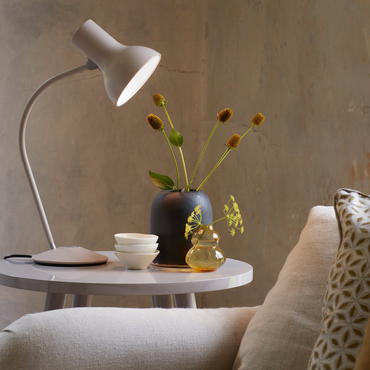 Anglepoise Type 75 Mini table lamp in Mole Gray on a round white side table