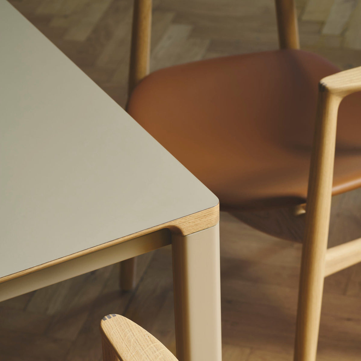 Bent Hansen Asger Dining Chair in oiled oak, cognac leather seat, styled in an interior setting, oak and leather