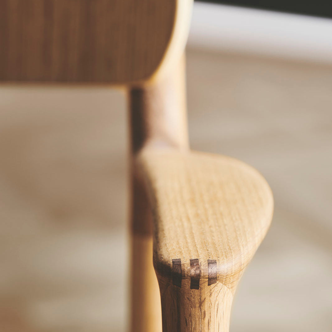 Detail of Bent Hansen Asger Dining Chair showing the armrest joint