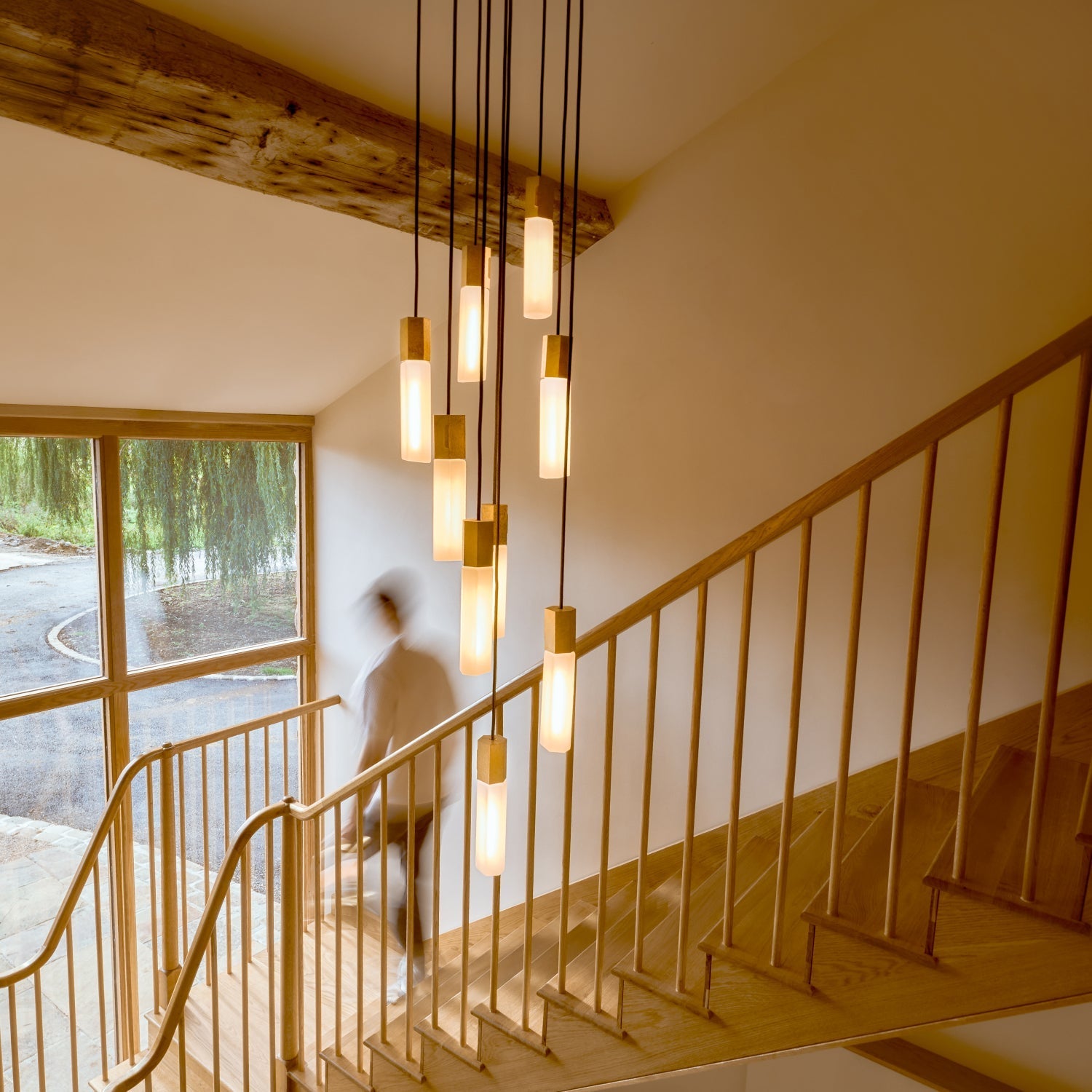 Basalt Nine Pendant by Tala in Brass, close-up of a single hexagonal pendant and glass bulb