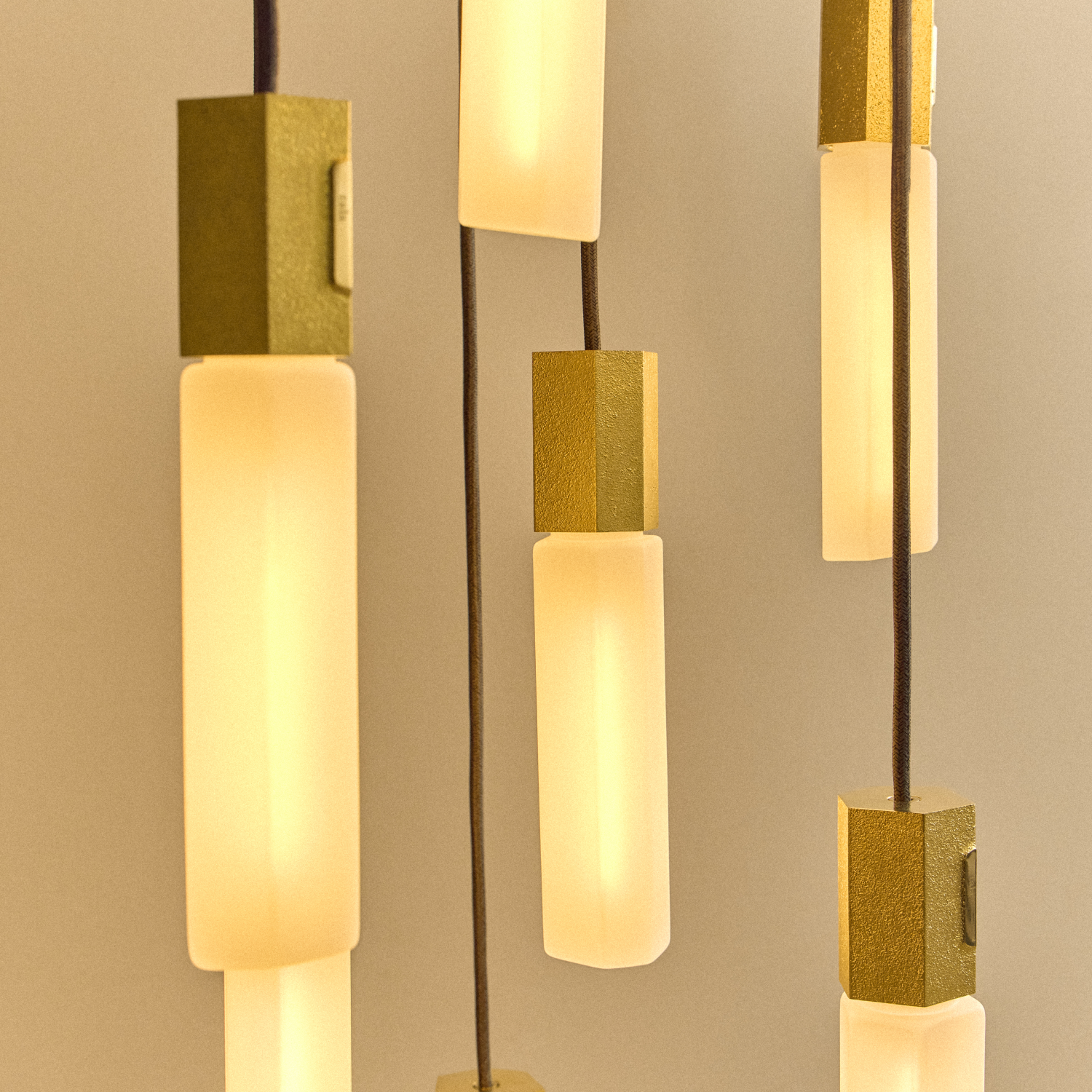 Basalt Nine Pendant by Tala in Brass, scale reference view of the hanging fixture