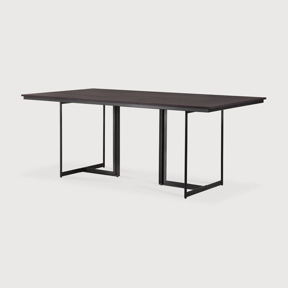 Ethnicraft Tacet Dining Table 78.5 in, three-quarter view, dark brown teak on black metal legs