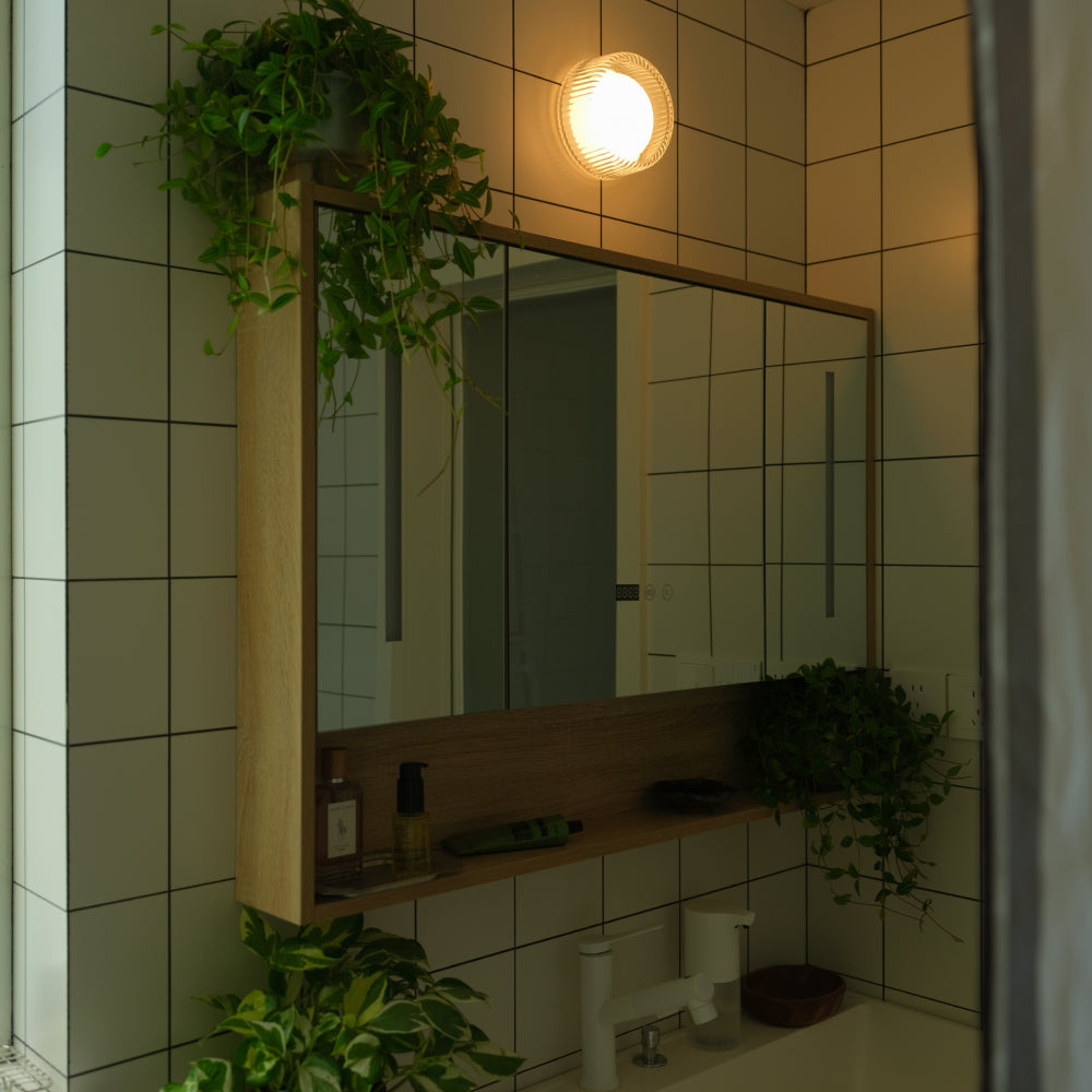 Firth Wall Light in White, shown in a bathroom setting