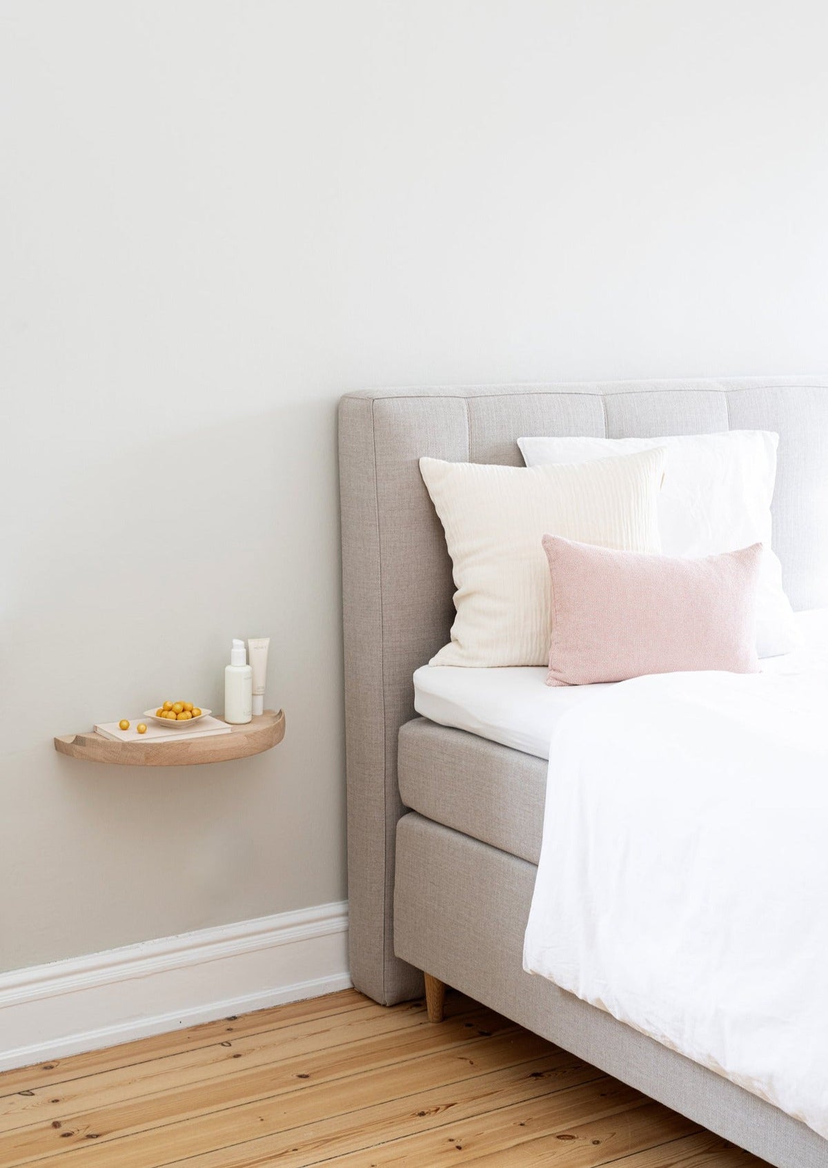Bedroom with an Aakjaer Arcus Console Shelf in white oiled oak as a floating bedside table