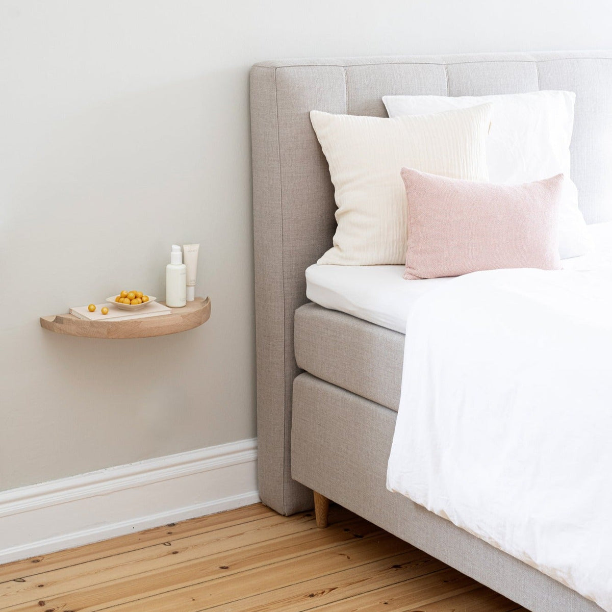 Bedroom with an Aakjaer Arcus Console Shelf in white oiled oak as a floating bedside table