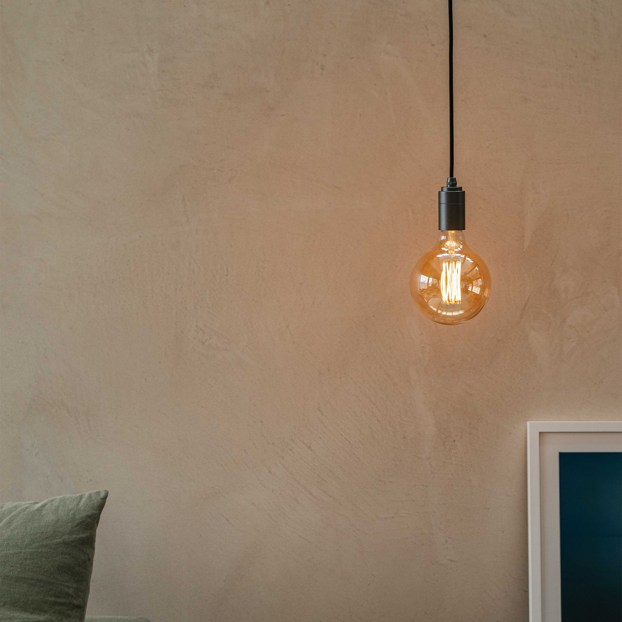 Gaia Pendant Light in Graphite, shown in a living room setting