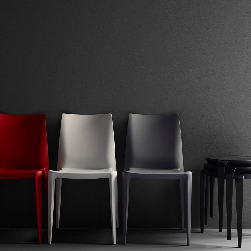 Heller Bellini Chairs in grey, red and white with stacked side tables