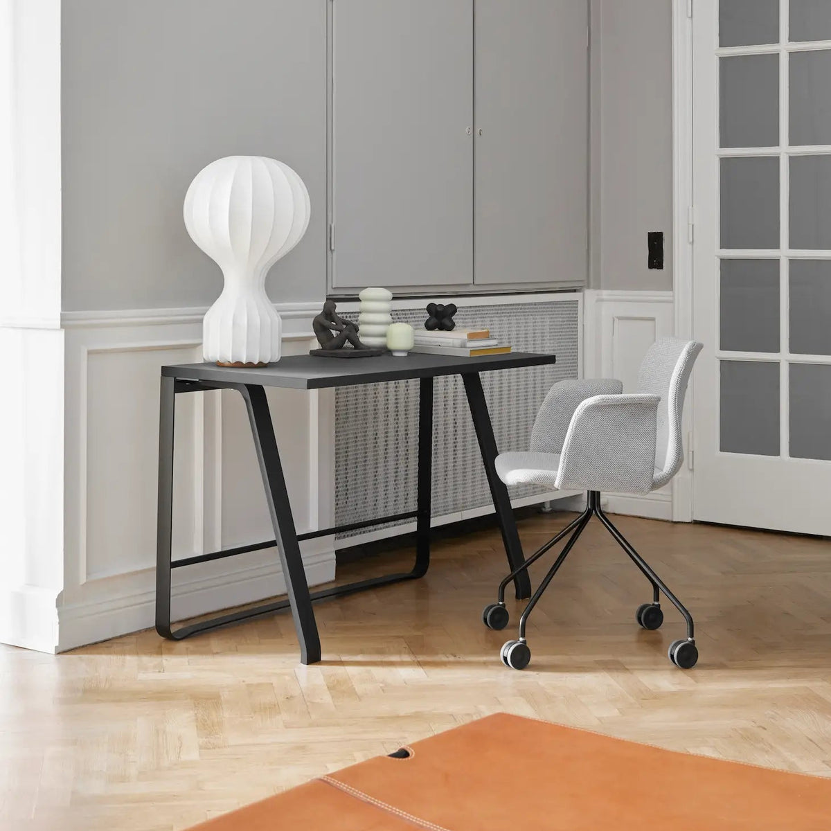 Bent Hansen Hemingway Desk in black linoleum, black legs, styled in an interior setting, beech and steel