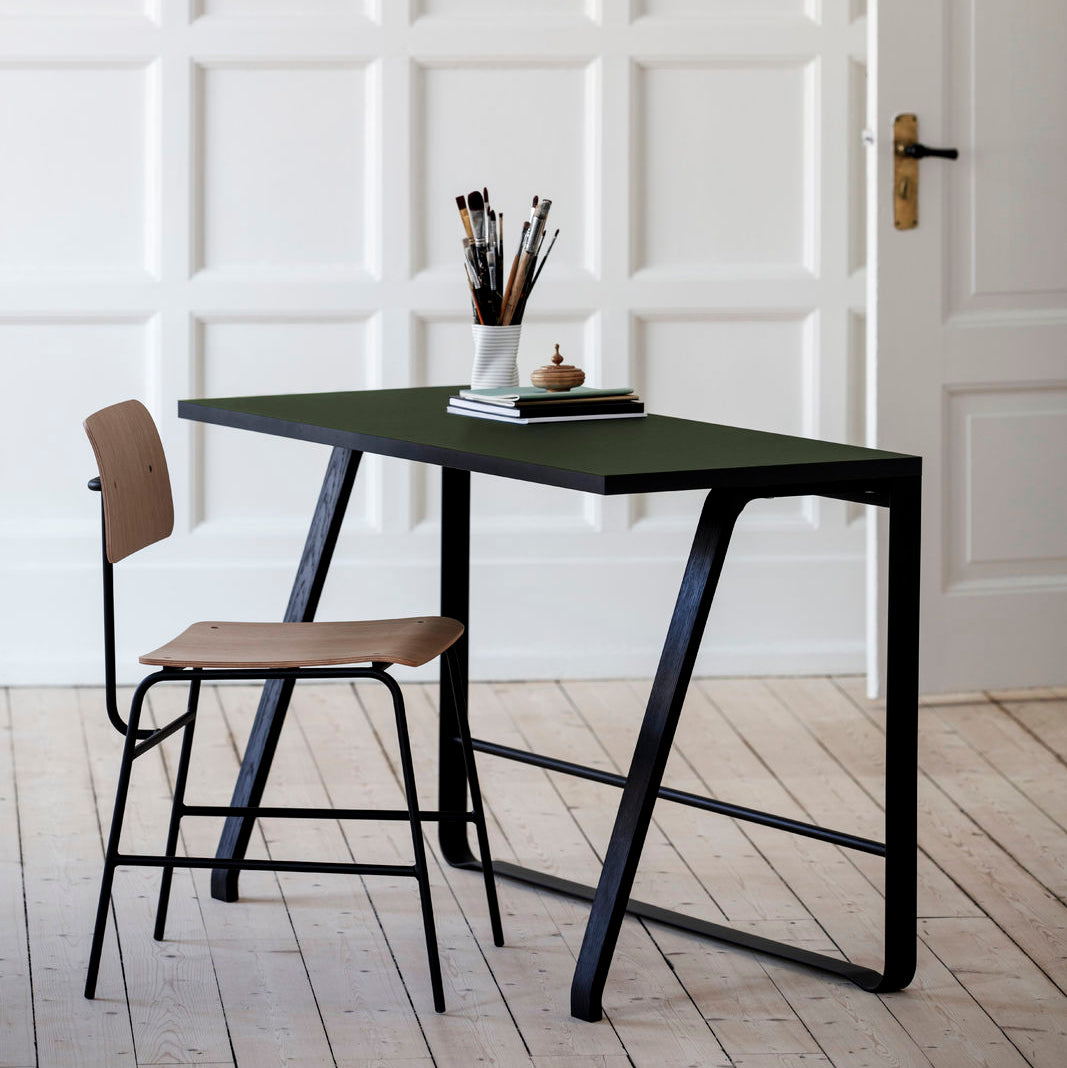 Bent Hansen Hemingway Desk in black linoleum, black legs, styled in an interior setting, beech and steel
