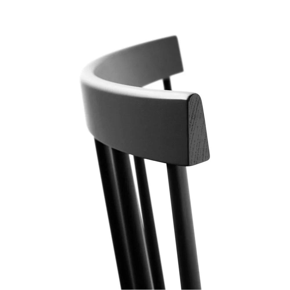 FDB Møbler Chair in jet black solid beech, designed in 1955 by Poul M. Volther, a Danish mid-century cooperative design