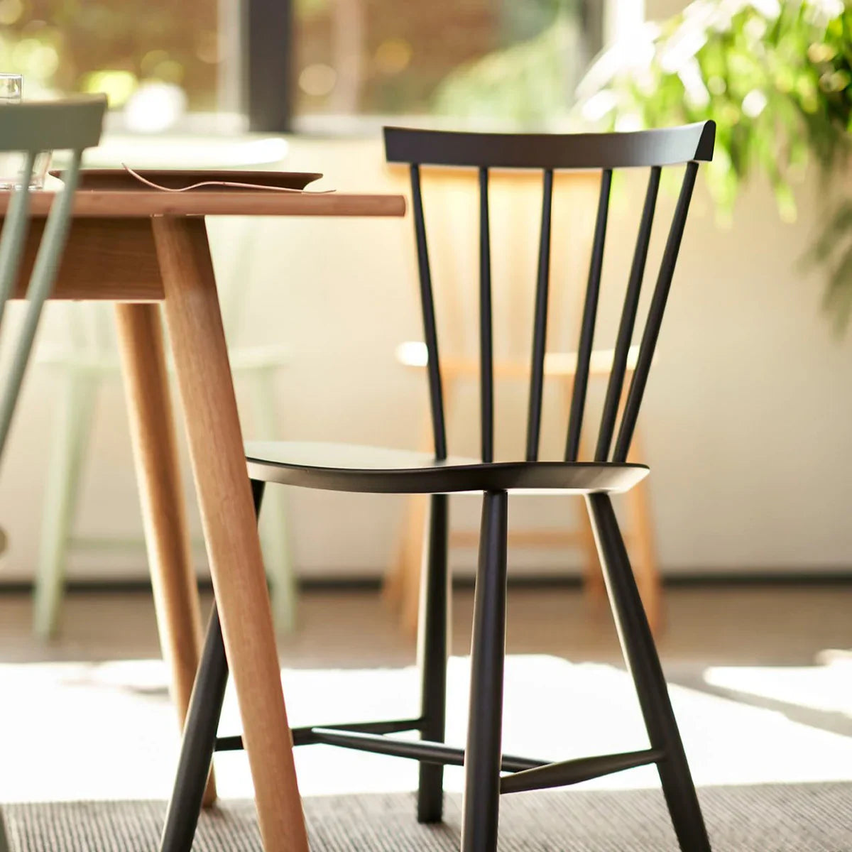 FDB Møbler Chair in jet black solid beech, designed in 1955 by Poul M. Volther, a Danish mid-century cooperative design