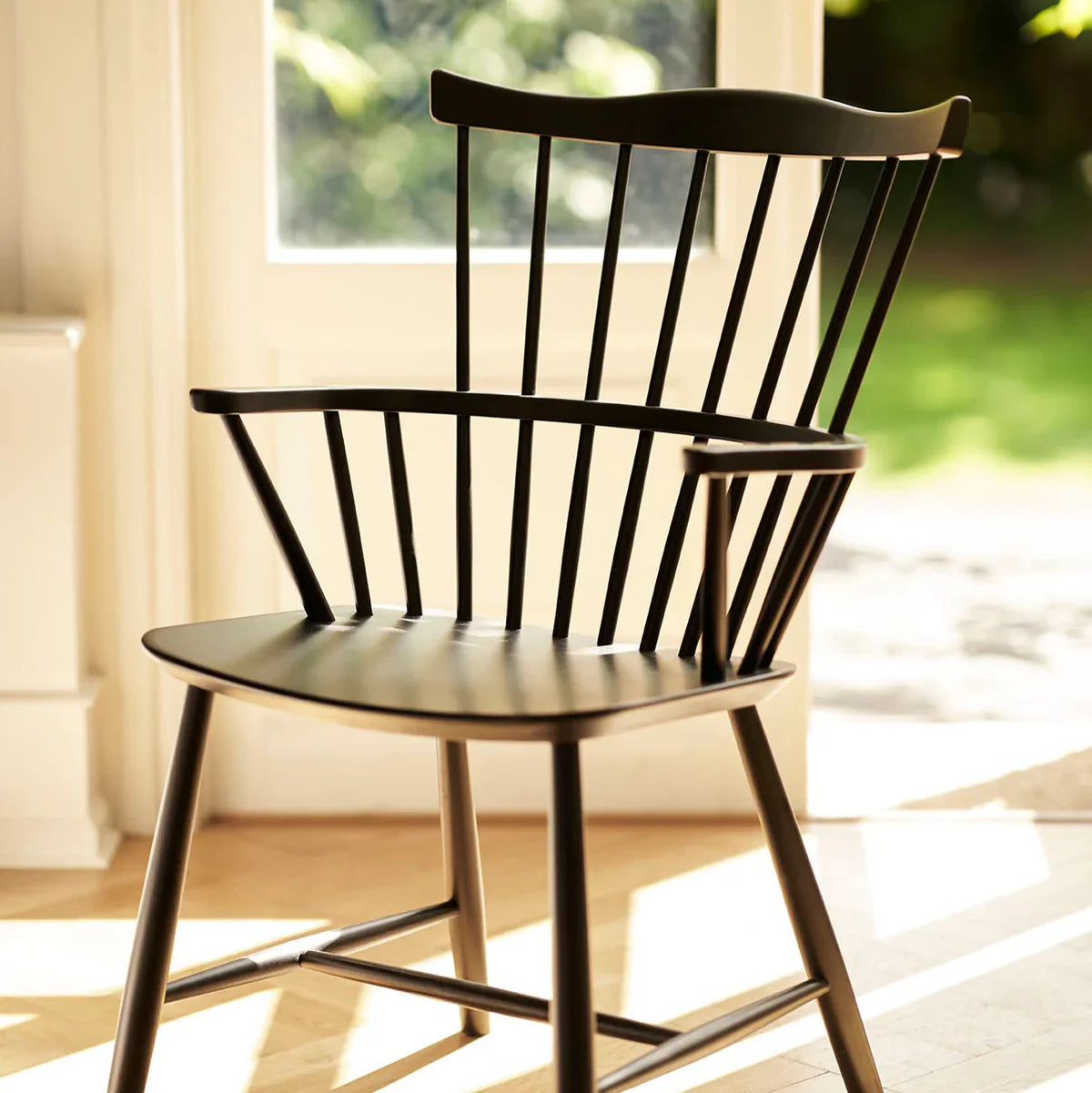 FDB Møbler Chair in jet black solid beech styled in an interior setting