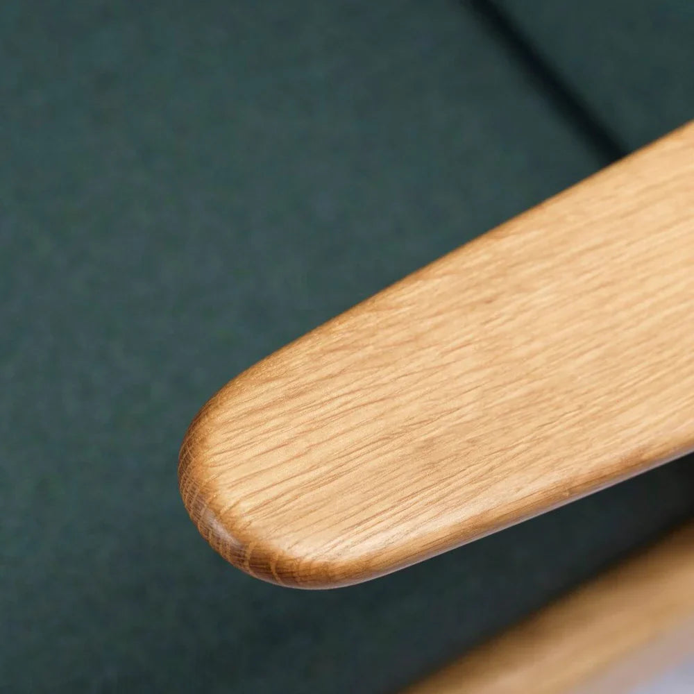 FDB Møbler Armchair in solid oak (green), designed by Poul M. Volther