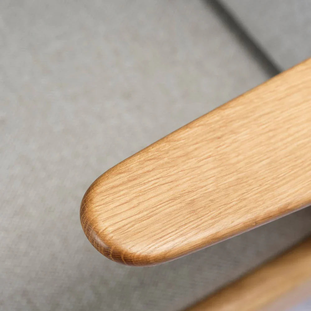 FDB Møbler Armchair in solid oak (light grey), designed by Poul M. Volther