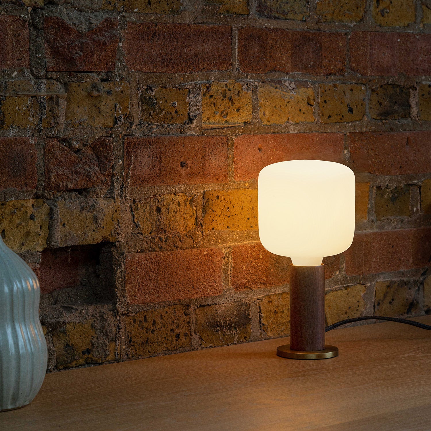 Knuckle Table Lamp in Walnut with Oblo bulb, lifestyle setting