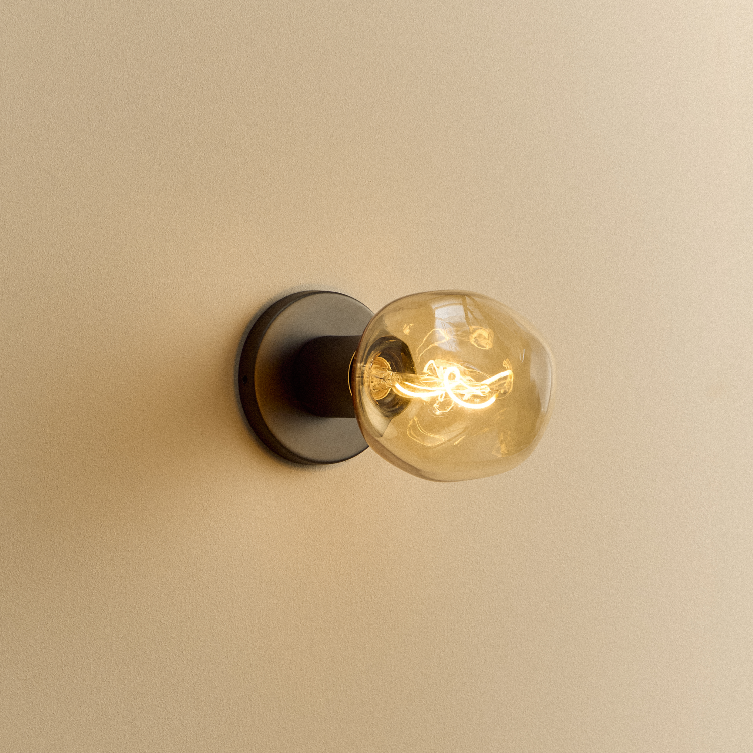 Lochan Wall Light in Graphite with Voronoi I bulb, illuminated