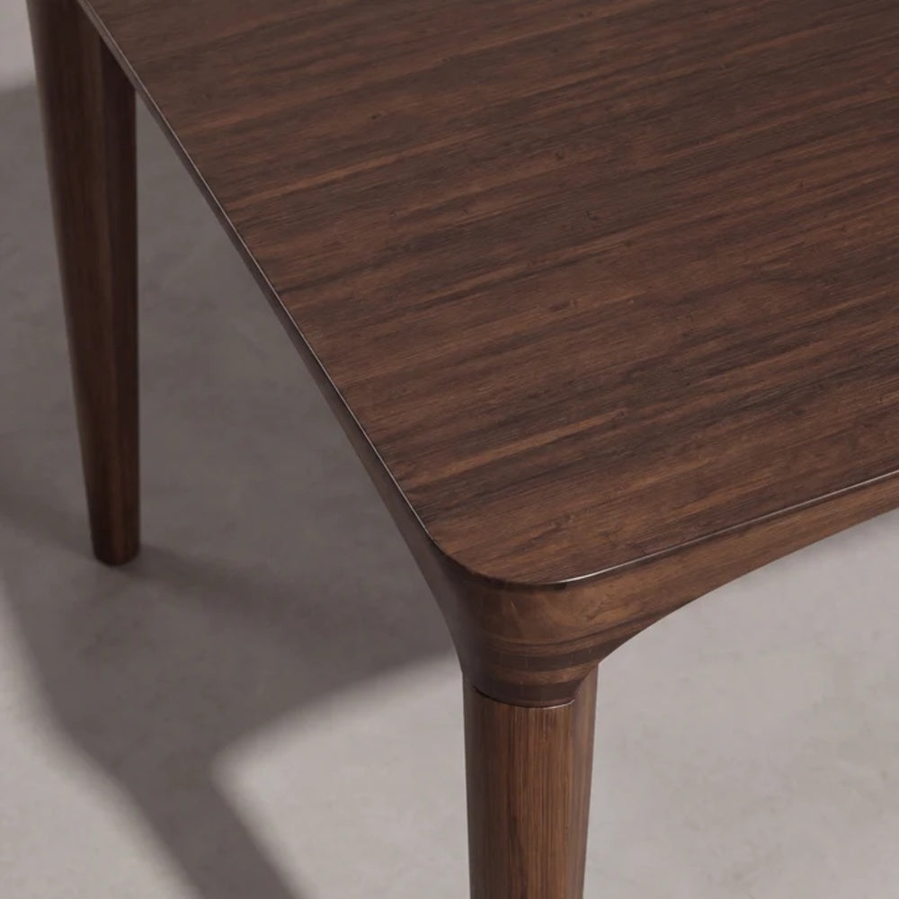 Detail of the Greenington Marseilles dining table edge in Black Walnut bamboo