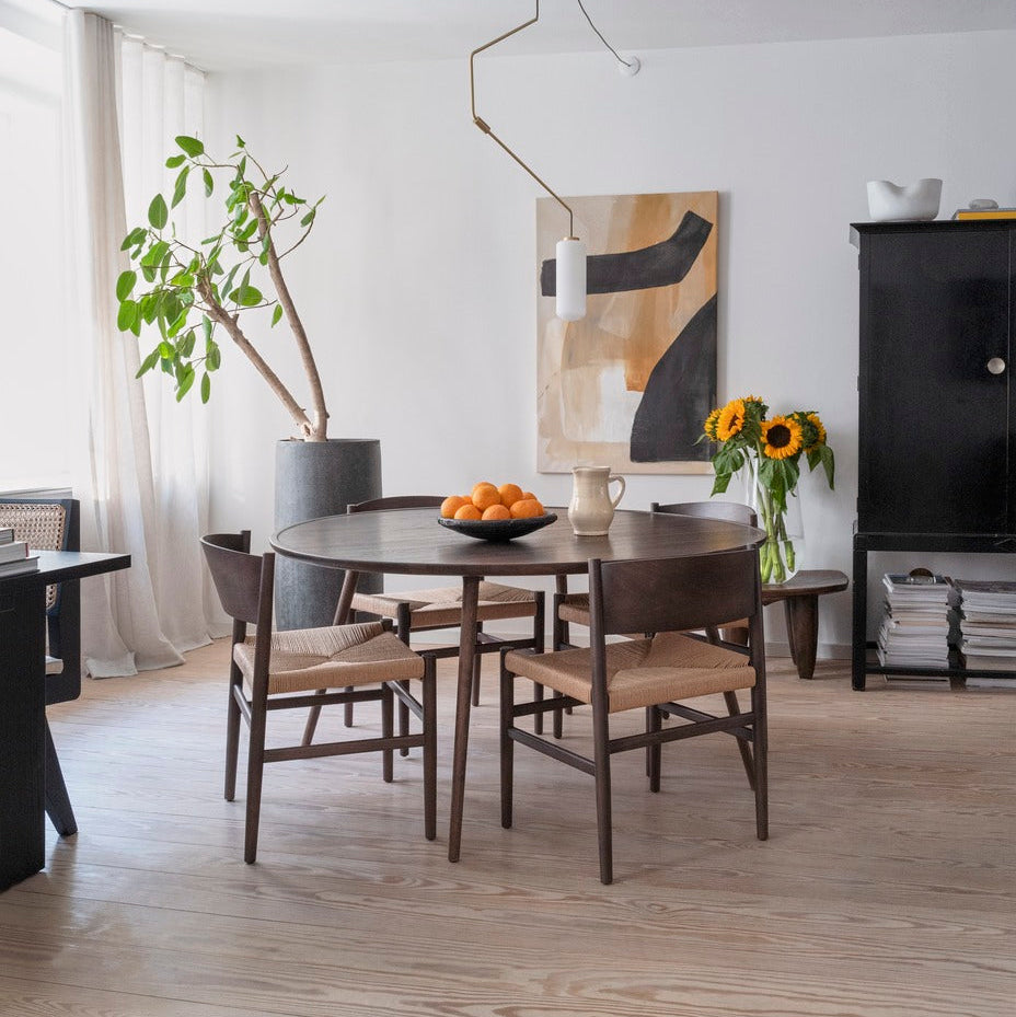 Mater Nestor Sidechair in solid wood styled in an interior setting
