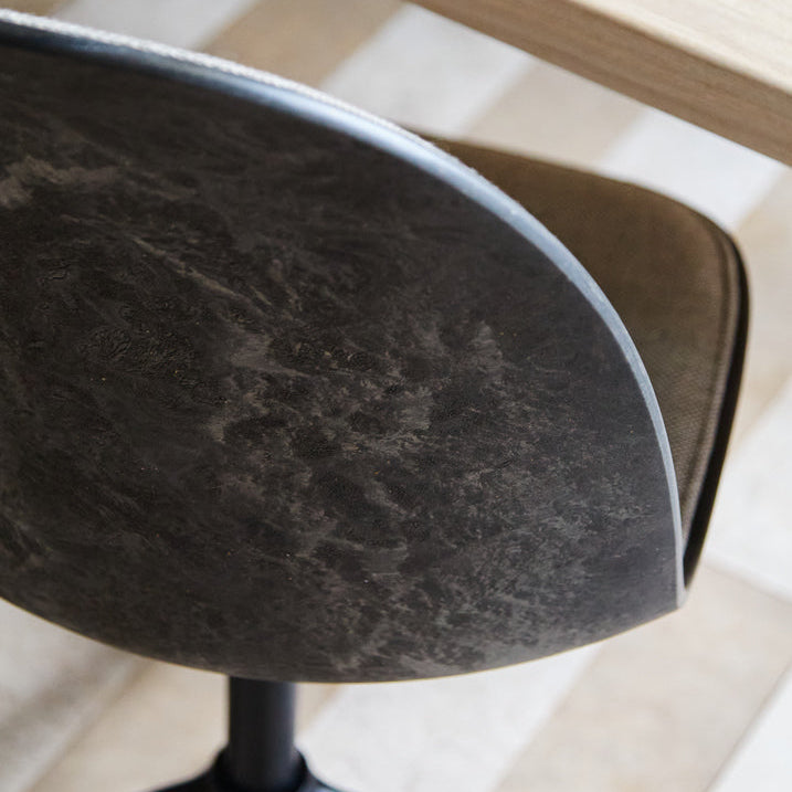Mater Eternity Swivel Chair with Wheels in upholstered beige Re-wool, styled in an interior setting