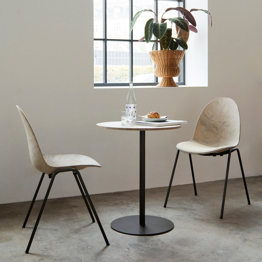 Mater Eternity Side Chair in Wood Waste Grey styled in an interior setting, Matek shell on a recycled steel frame