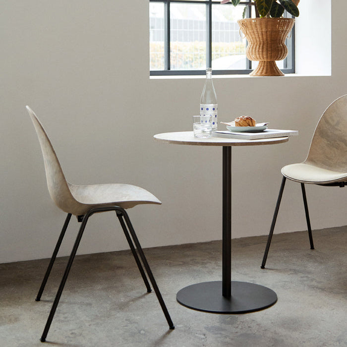 Mater Eternity Side Chair in Wood Waste Grey styled in an interior setting, Matek shell on a recycled steel frame