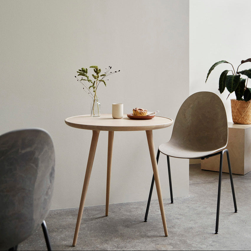 Mater Eternity Side Chair in Coffee Waste Dark styled in an interior setting, Matek shell on a recycled steel frame