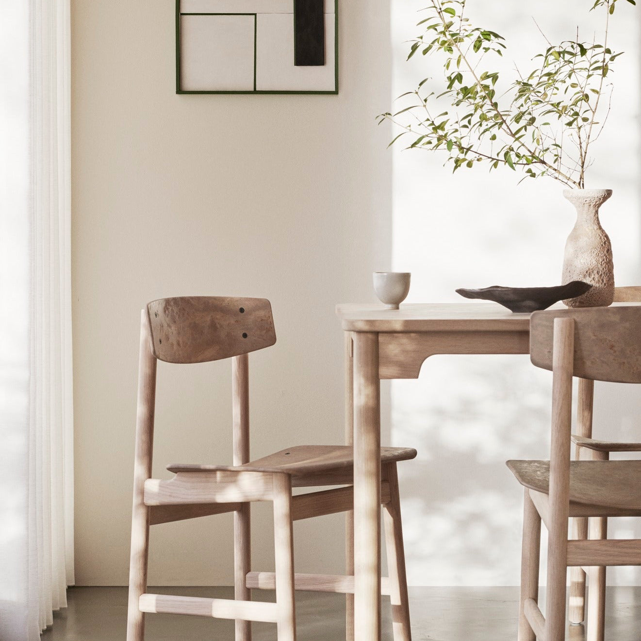 Mater Conscious Chair in solid wood, designed by Jorgen Moller, styled in an interior setting