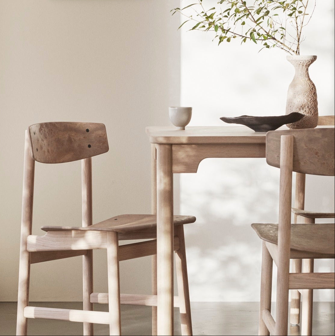 Mater Conscious Table in solid wood, designed by Jorgen Moller, styled in a dining room