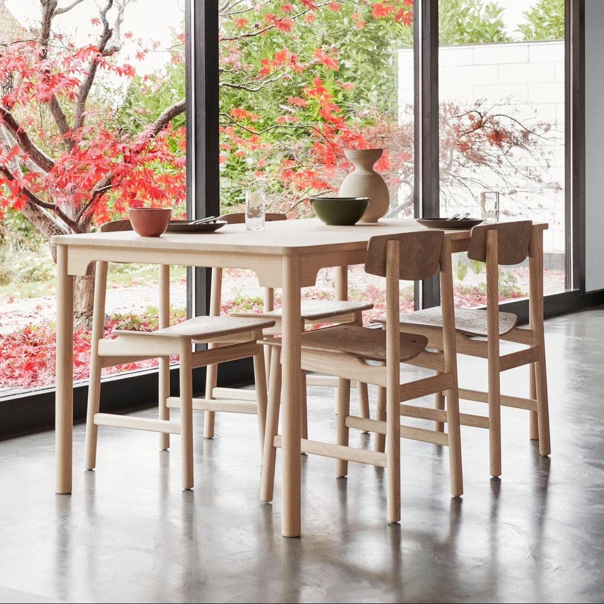Mater Conscious Table in solid wood, designed by Jorgen Moller, styled in a dining room