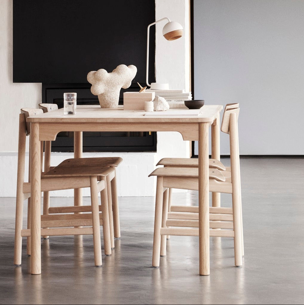 Mater Conscious Table in solid wood, designed by Jorgen Moller, styled in a dining room