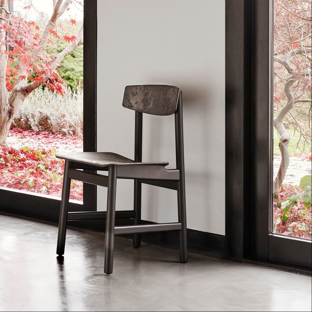 Mater Conscious Chair in solid wood, designed by Jorgen Moller, styled in an interior setting