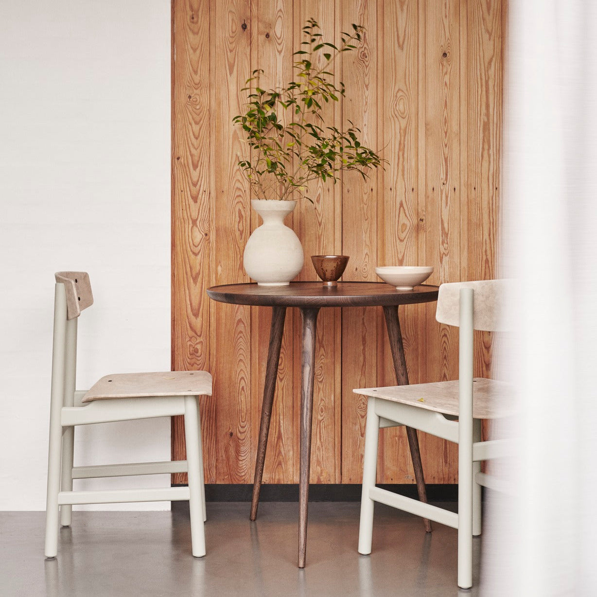 Mater Conscious Chair in solid wood, designed by Jorgen Moller, styled in an interior setting