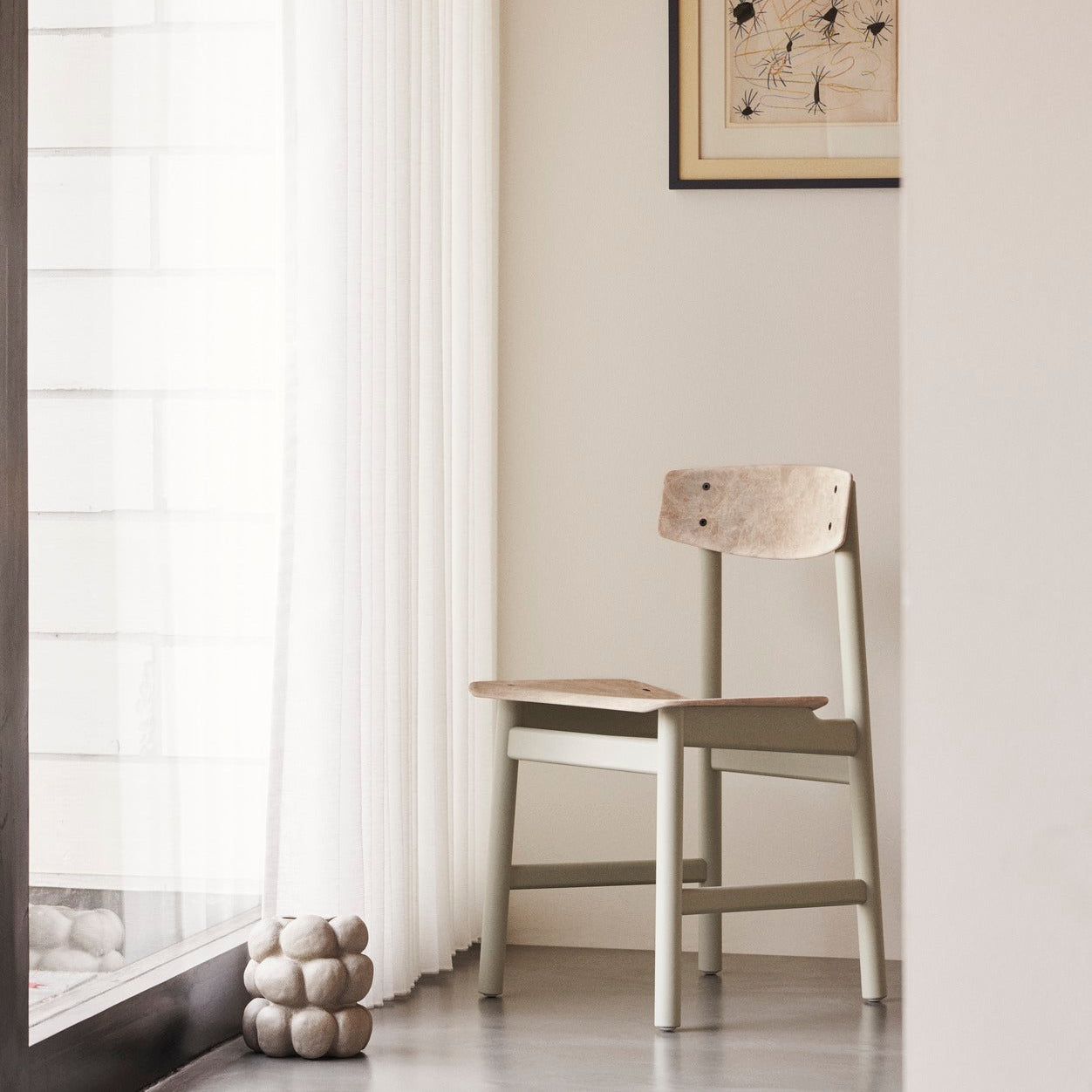 Mater Conscious Chair in solid wood, designed by Jorgen Moller, styled in an interior setting