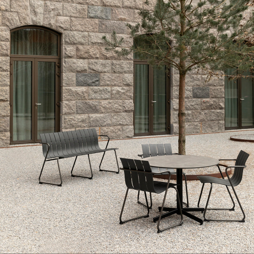 Mater Ocean Chair styled in an outdoor setting, slats of recycled plastic waste