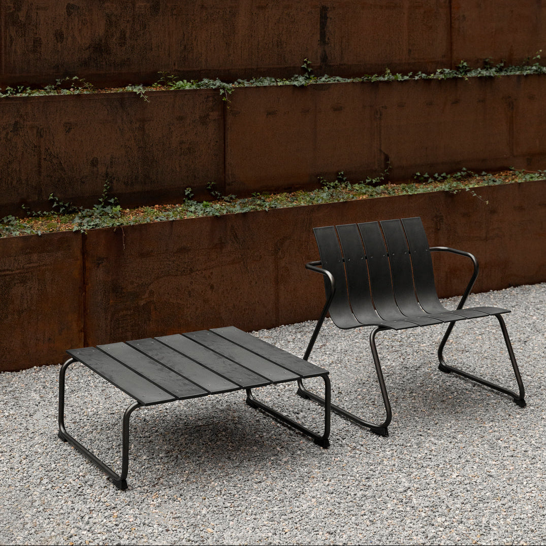 Mater Ocean Lounge Chair styled in an outdoor setting, slats of recycled plastic waste