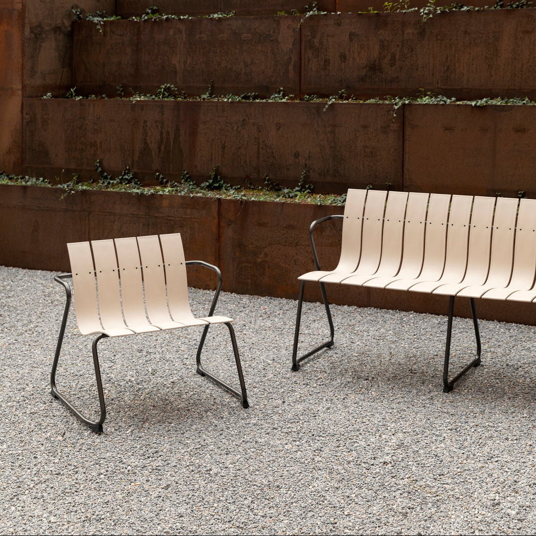 Mater Ocean Lounge Chair styled in an outdoor setting, slats of recycled plastic waste