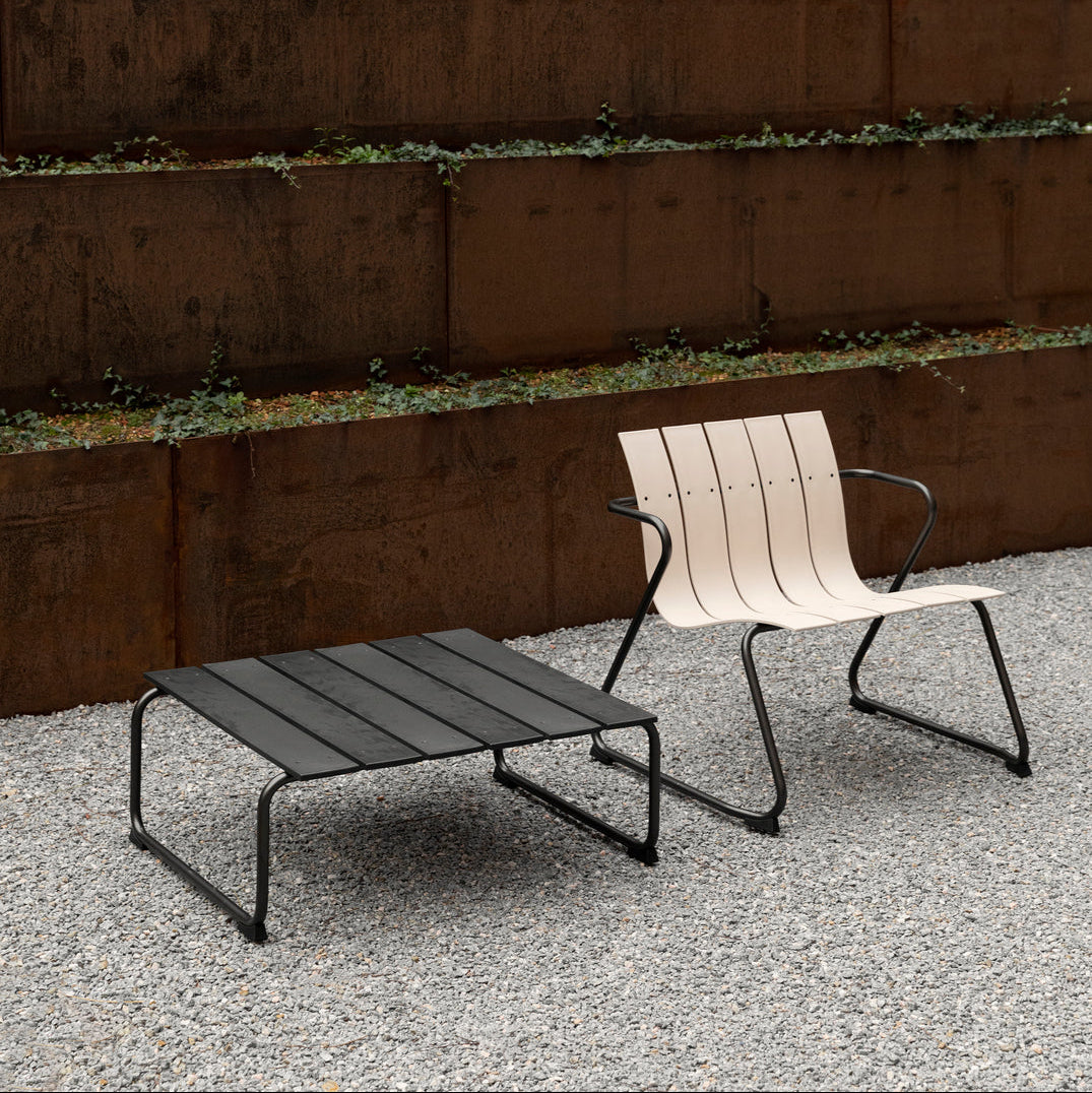 Mater Ocean Lounge Chair styled in an outdoor setting, slats of recycled plastic waste