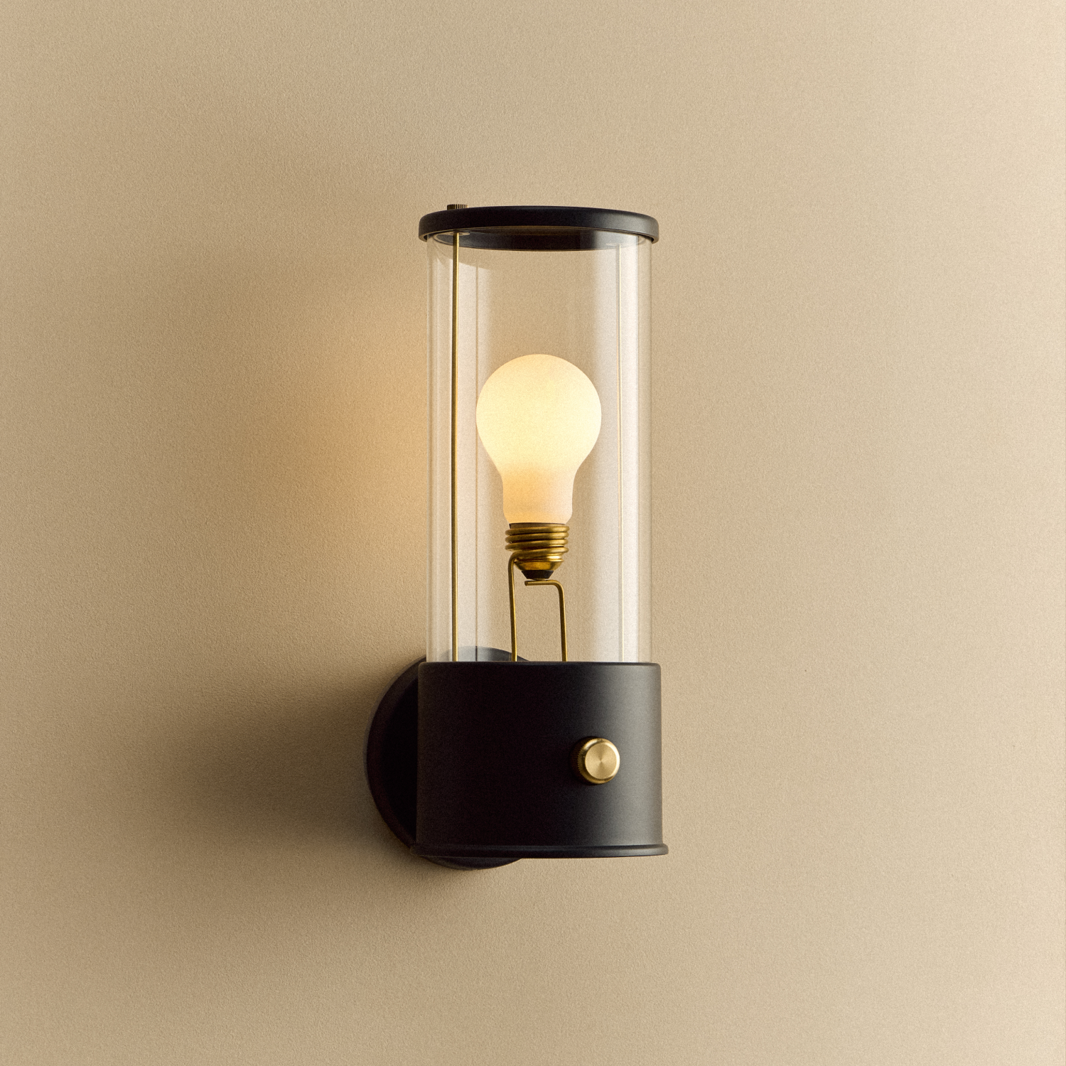 The Muse Wall Light in Hackles Black, illuminated