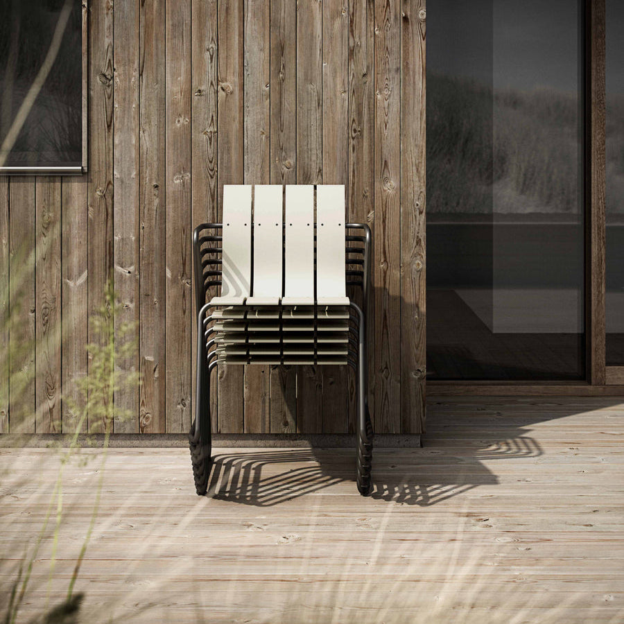 Mater Ocean Chair styled in an outdoor setting, slats of recycled plastic waste
